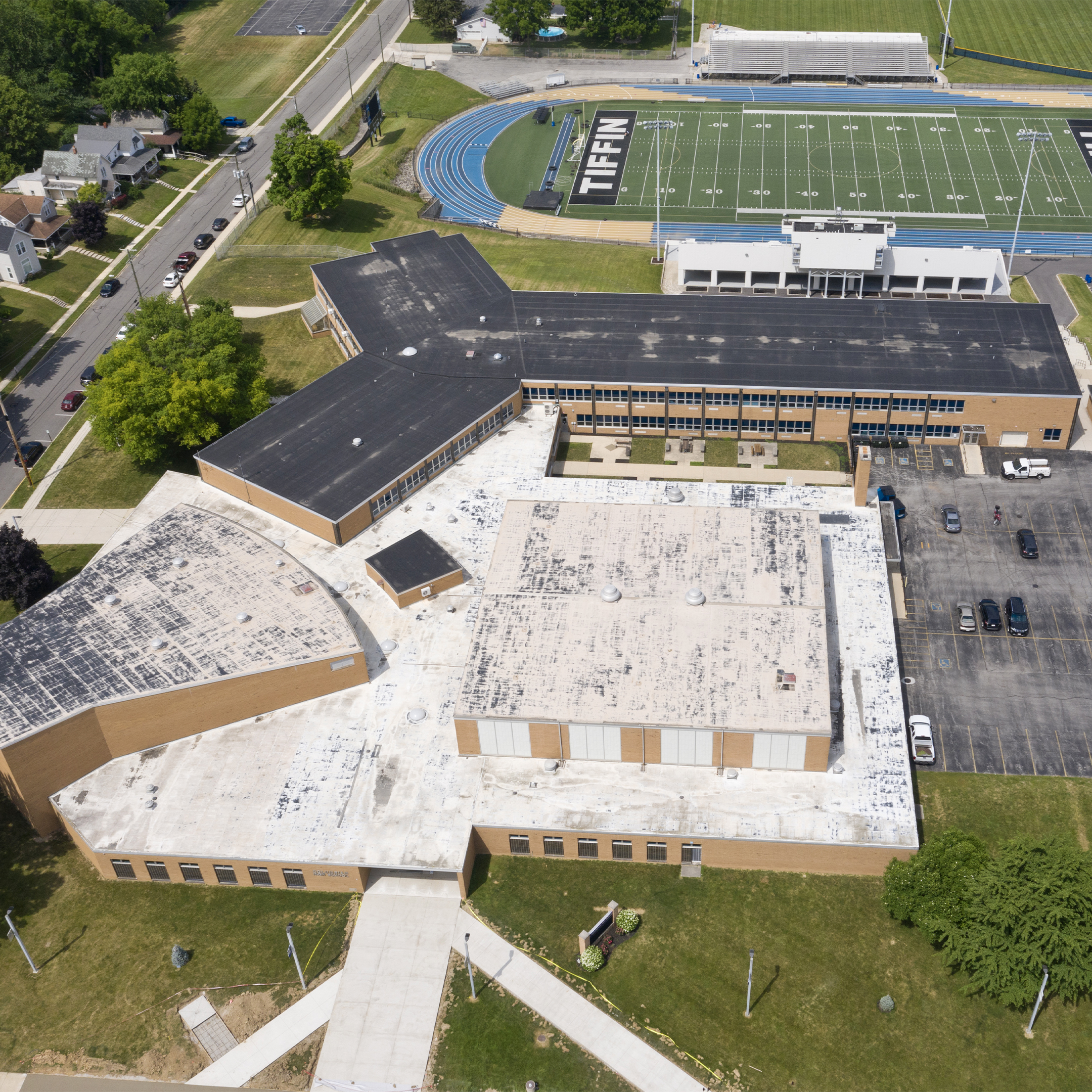 Commercial roof before SPF application — worn, dark surface