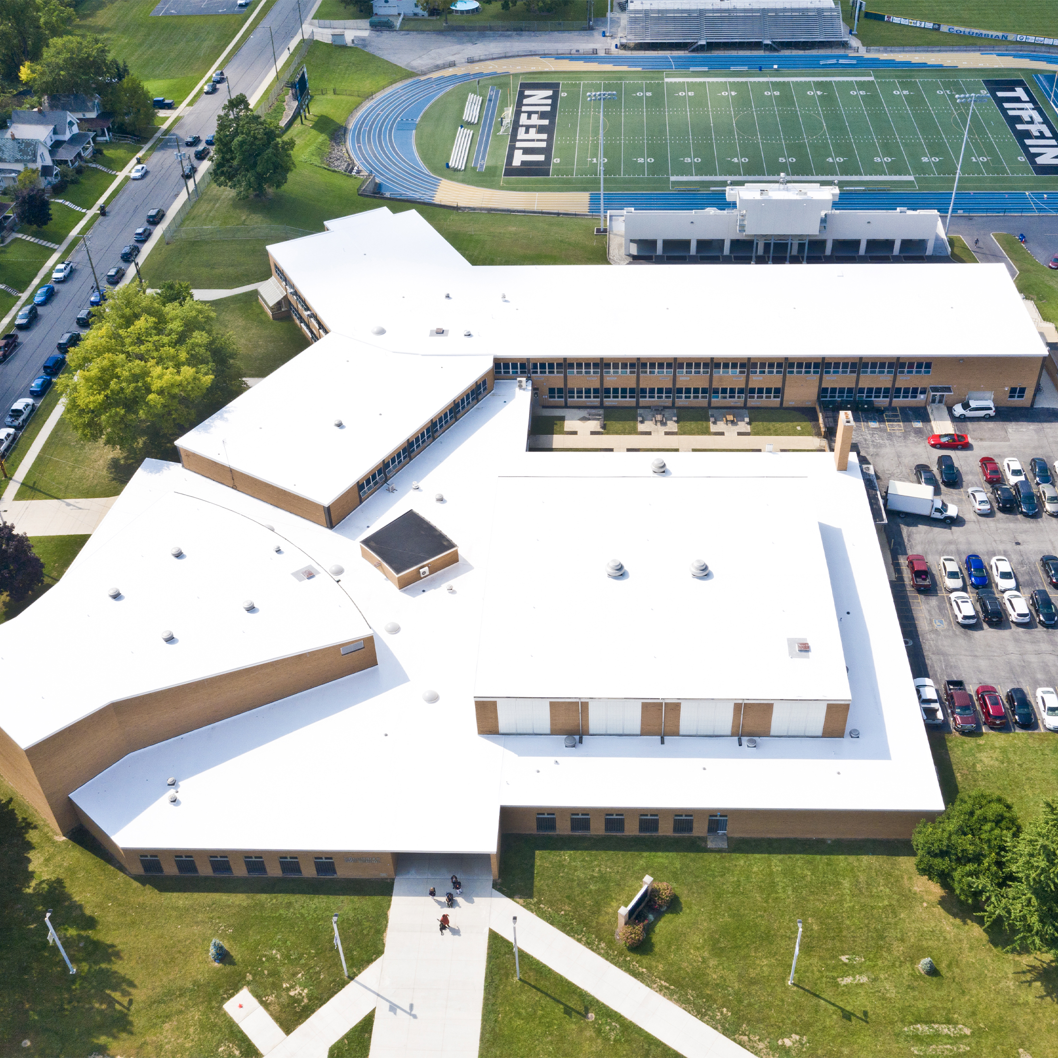 Commercial roof after SPF application — bright white reflective surface